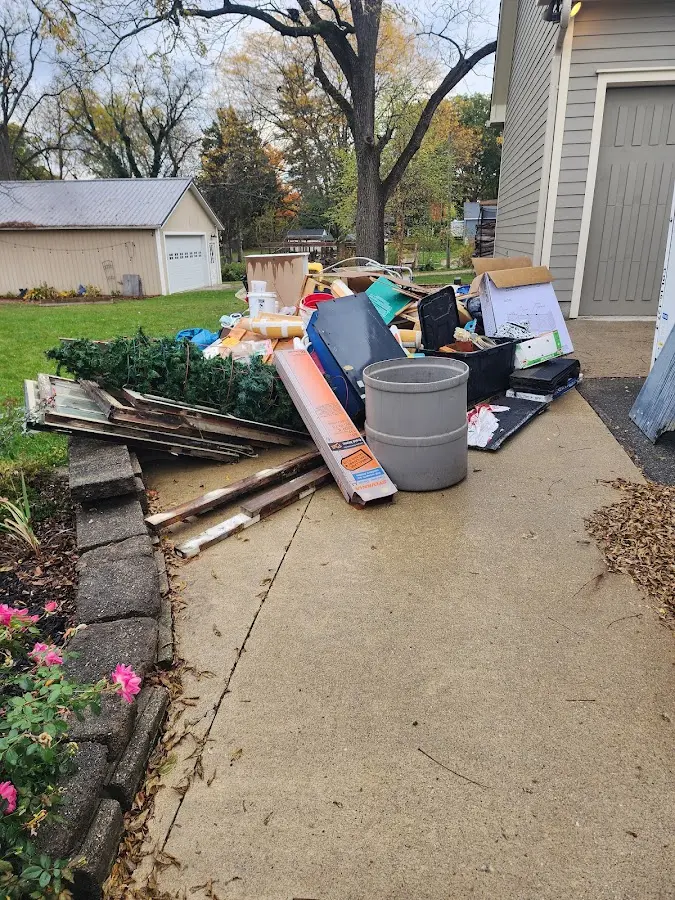 Dumpster being loaded with debris for Commercial Dumpster Rental in Brentwood